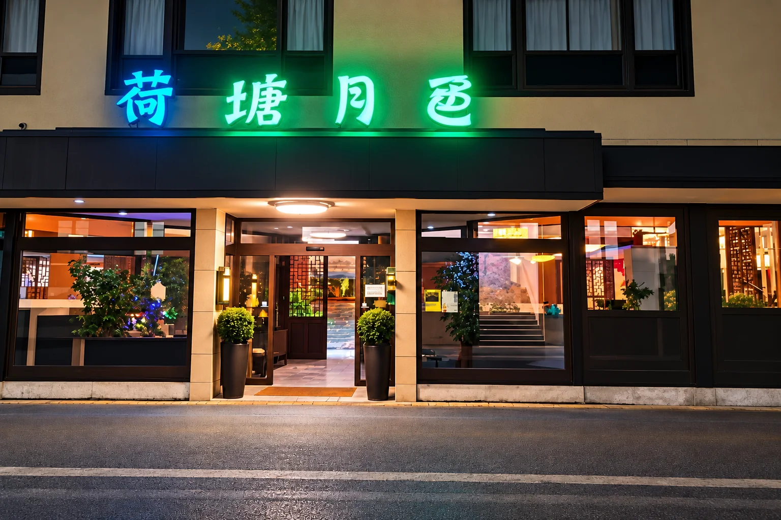 The Goldener Lotus entrance in the evening: Chinese neon lettering in blue and green above the dark canopy, a glass door with wooden lattice, a round potted plant on each side, lit windows.